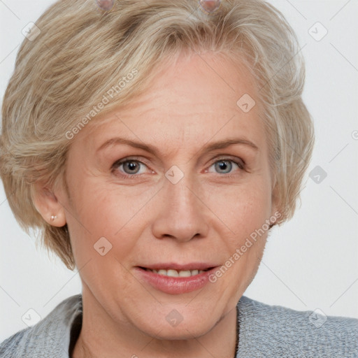 Joyful white adult female with medium  brown hair and blue eyes