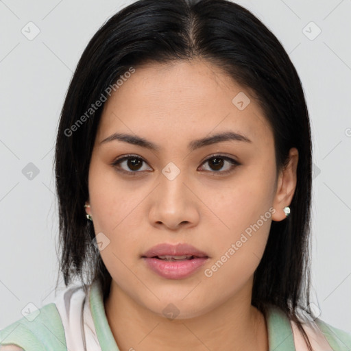 Joyful asian young-adult female with long  brown hair and brown eyes