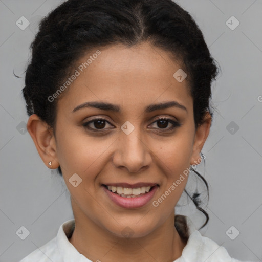 Joyful latino young-adult female with short  brown hair and brown eyes