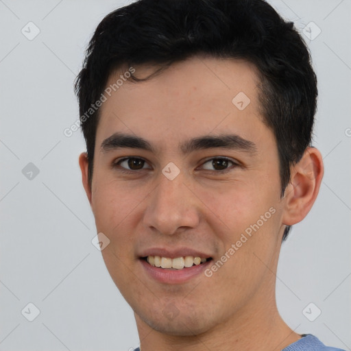 Joyful asian young-adult male with short  brown hair and brown eyes