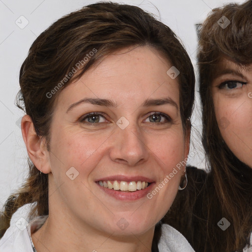 Joyful white young-adult female with medium  brown hair and blue eyes