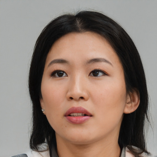 Neutral asian young-adult female with medium  black hair and brown eyes
