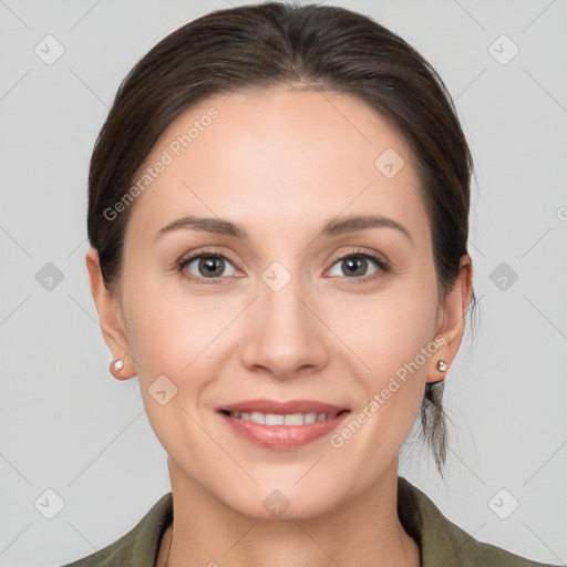 Joyful white young-adult female with medium  brown hair and grey eyes