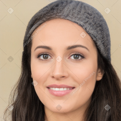 Joyful white young-adult female with long  black hair and brown eyes