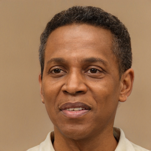 Joyful latino adult male with short  brown hair and brown eyes