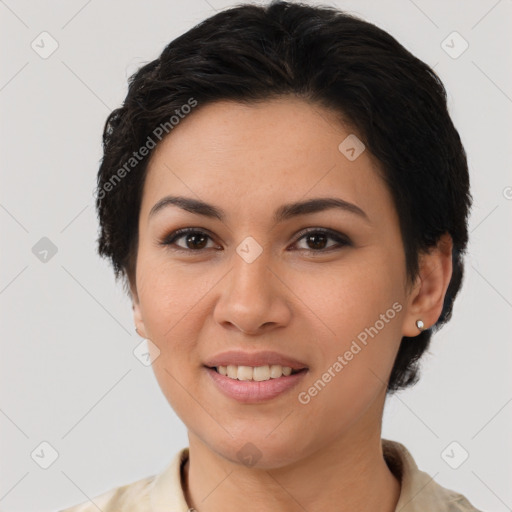 Joyful latino young-adult female with short  brown hair and brown eyes