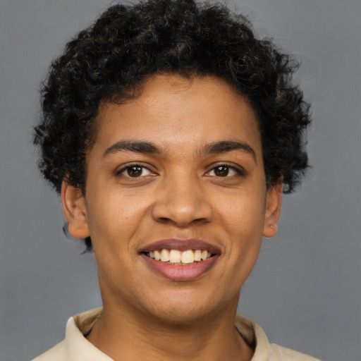 Joyful latino young-adult male with short  brown hair and brown eyes