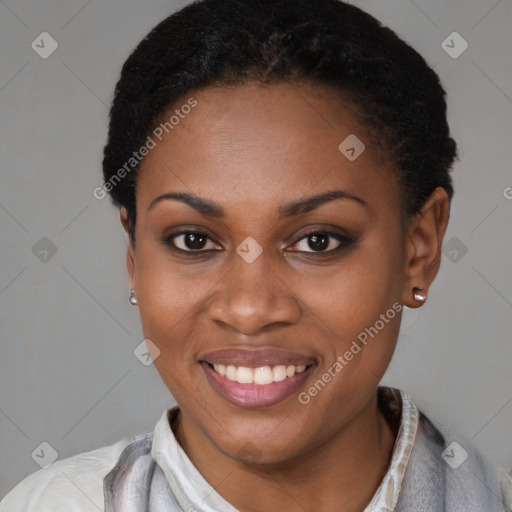 Joyful black young-adult female with short  black hair and brown eyes