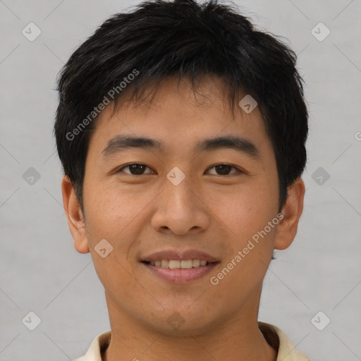 Joyful asian young-adult male with short  brown hair and brown eyes