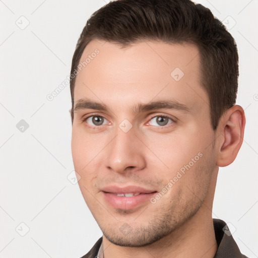 Joyful white young-adult male with short  brown hair and brown eyes