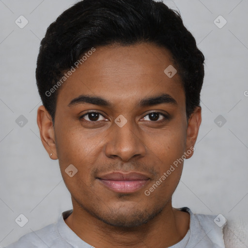 Joyful black young-adult male with short  brown hair and brown eyes