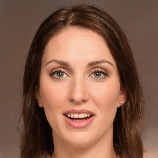 Joyful white young-adult female with long  brown hair and green eyes