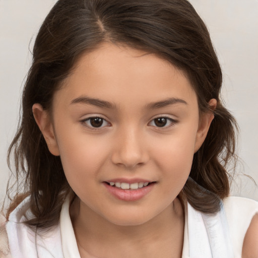 Joyful white child female with medium  brown hair and brown eyes