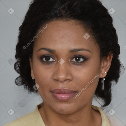 Joyful black adult female with medium  brown hair and brown eyes