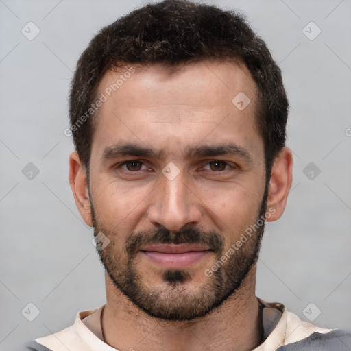 Joyful white young-adult male with short  black hair and brown eyes
