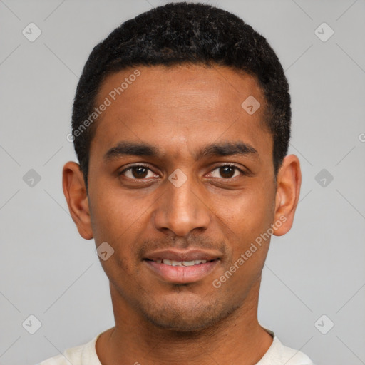 Joyful black young-adult male with short  black hair and brown eyes