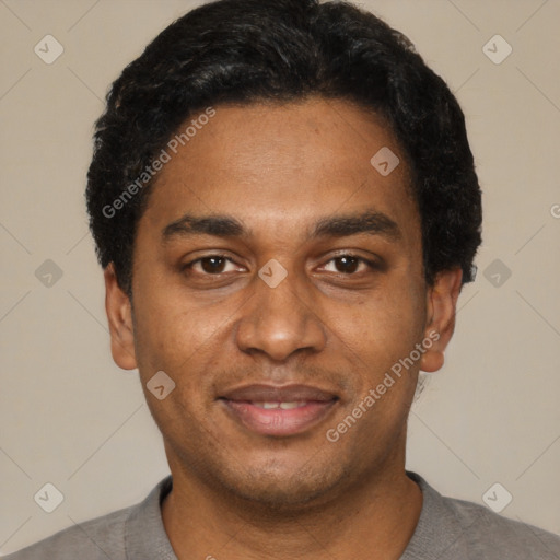 Joyful black young-adult male with short  black hair and brown eyes
