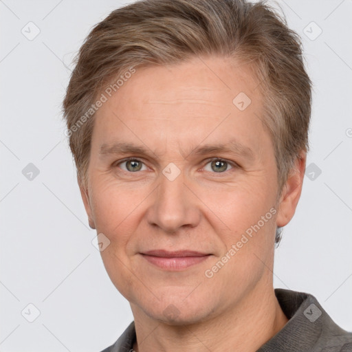 Joyful white adult male with short  brown hair and grey eyes