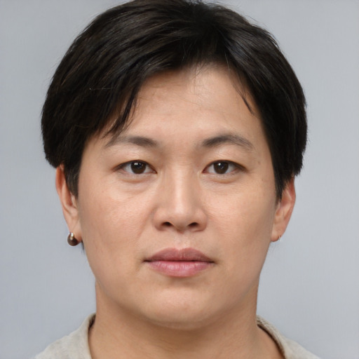 Neutral asian young-adult male with short  brown hair and brown eyes