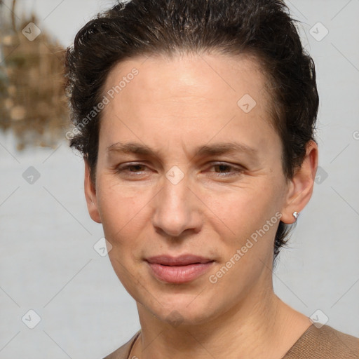 Joyful white adult female with short  brown hair and brown eyes