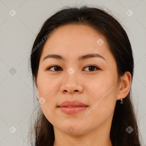 Joyful asian young-adult female with long  brown hair and brown eyes