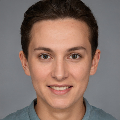 Joyful white adult female with short  brown hair and brown eyes