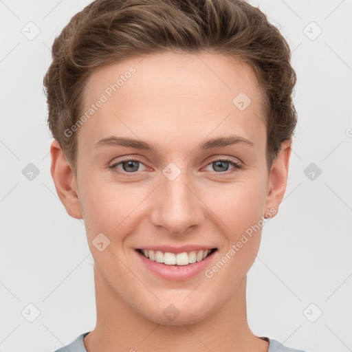 Joyful white young-adult female with short  brown hair and grey eyes