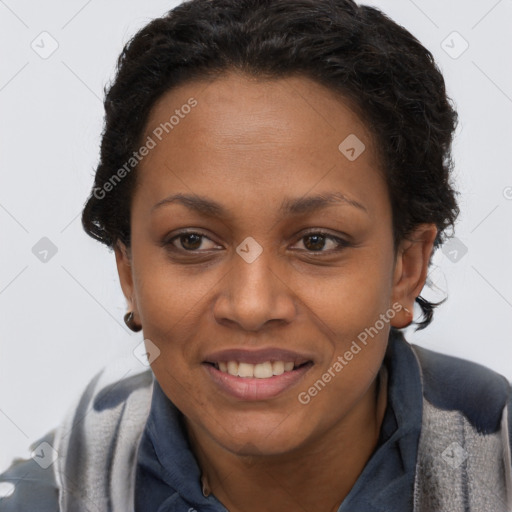 Joyful black adult female with short  brown hair and brown eyes