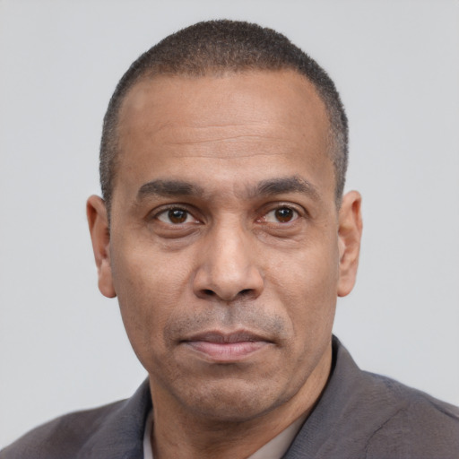 Neutral latino adult male with short  black hair and brown eyes