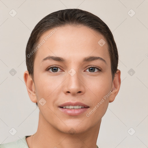 Joyful white young-adult female with short  brown hair and brown eyes