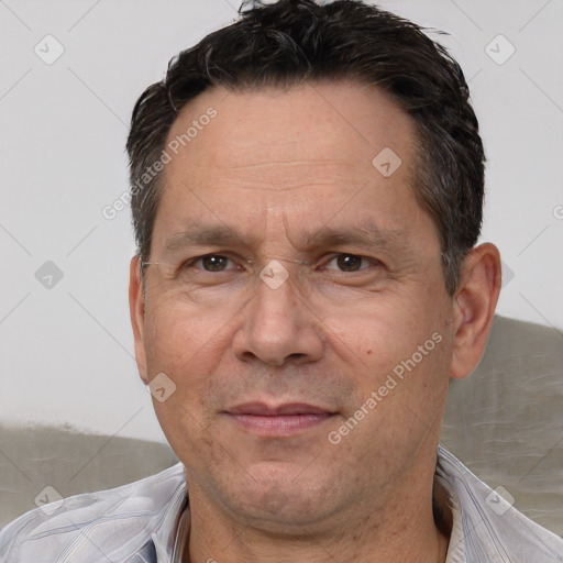 Joyful white adult male with short  brown hair and brown eyes