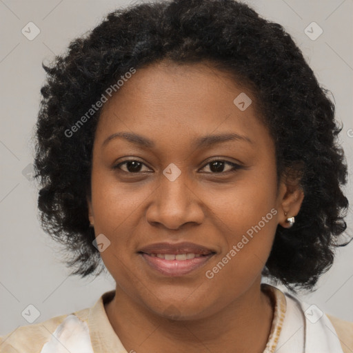 Joyful black adult female with medium  brown hair and brown eyes