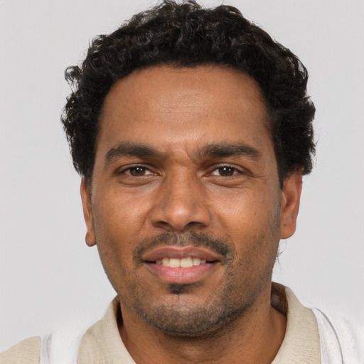 Neutral black adult male with short  black hair and brown eyes