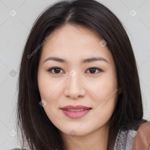 Joyful asian young-adult female with long  brown hair and brown eyes