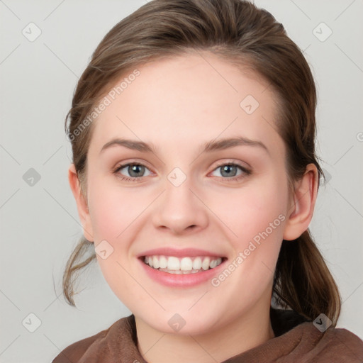 Joyful white young-adult female with medium  brown hair and blue eyes