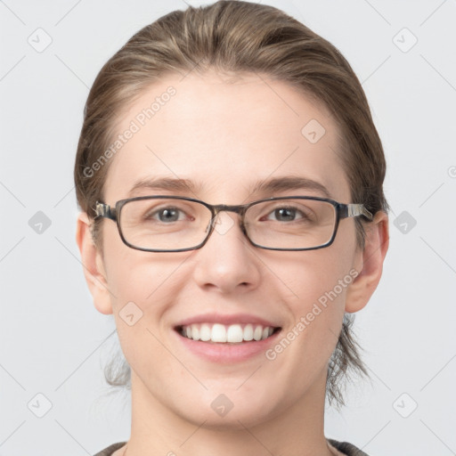 Joyful white young-adult female with medium  brown hair and grey eyes