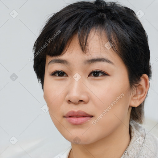 Joyful asian young-adult female with medium  brown hair and brown eyes