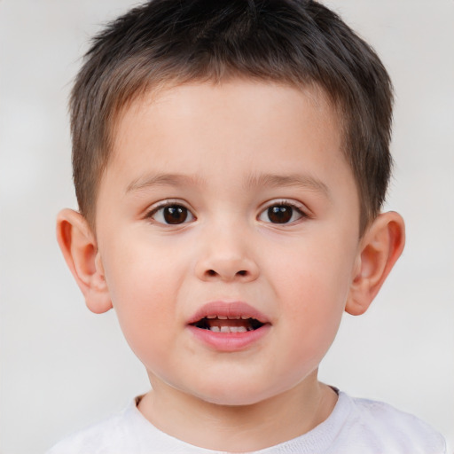 Joyful white child male with short  brown hair and brown eyes