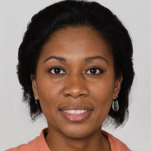 Joyful black young-adult female with medium  brown hair and brown eyes