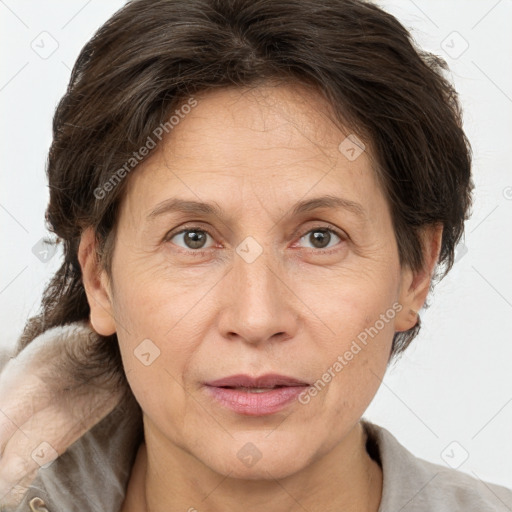 Joyful white adult female with short  brown hair and brown eyes