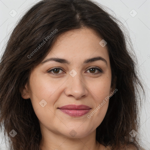 Joyful white young-adult female with long  brown hair and brown eyes