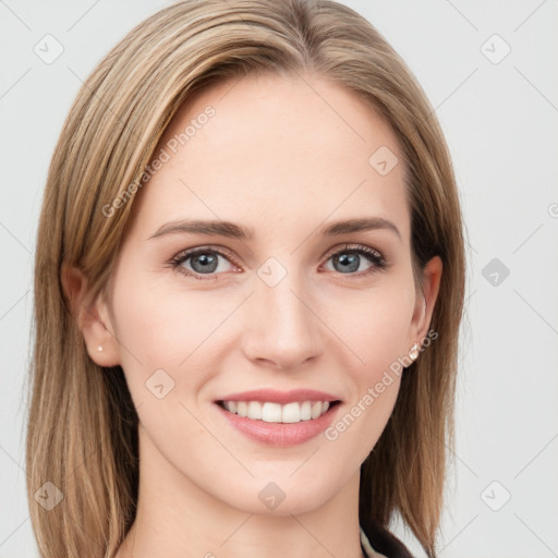 Joyful white young-adult female with long  brown hair and blue eyes