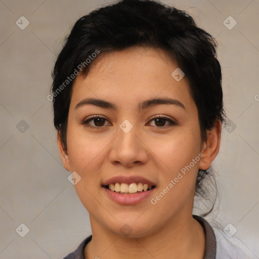 Joyful latino young-adult female with short  black hair and brown eyes