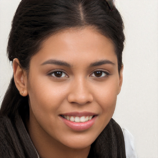 Joyful white young-adult female with long  brown hair and brown eyes