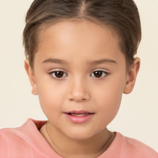 Joyful white child female with short  brown hair and brown eyes