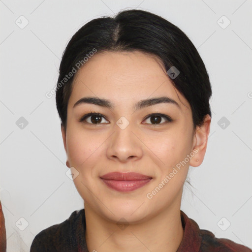 Joyful asian young-adult female with short  black hair and brown eyes