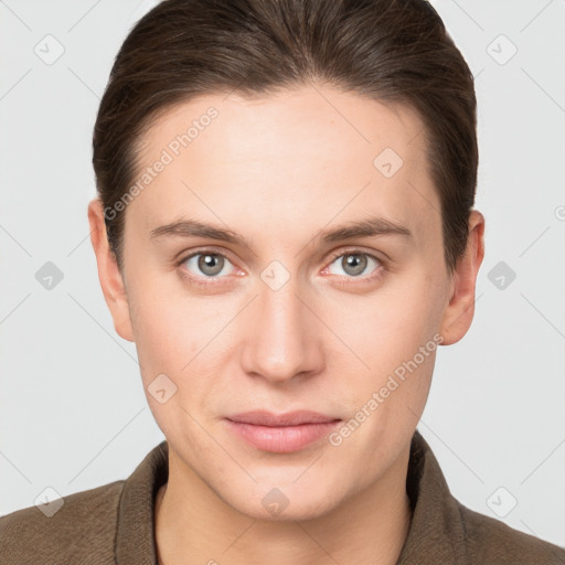 Joyful white young-adult female with short  brown hair and grey eyes