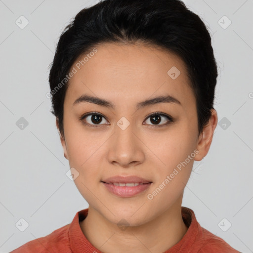 Joyful asian young-adult female with short  black hair and brown eyes