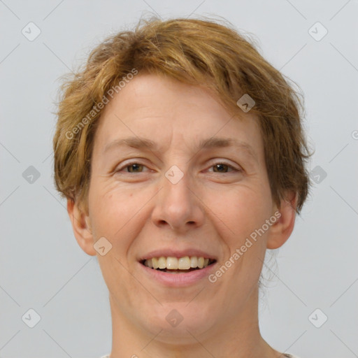 Joyful white adult female with short  brown hair and grey eyes