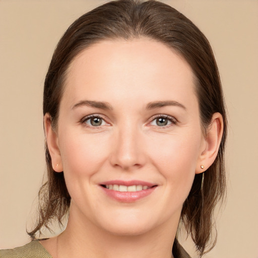 Joyful white young-adult female with medium  brown hair and brown eyes